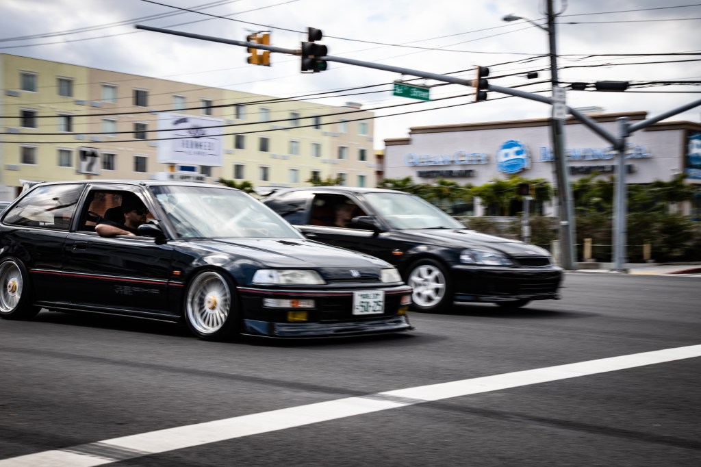 An EF Civic and EK Civic cruising Ocean City during H2Oi.